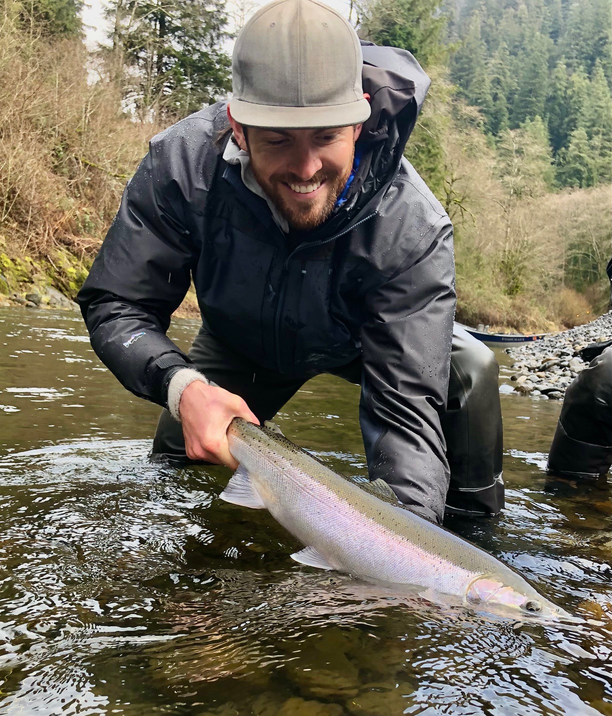 Dylan Stanford posing with a Wilson River steelhead